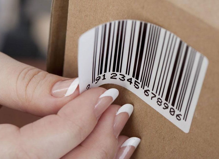 Barcode label applied to a shipping carton